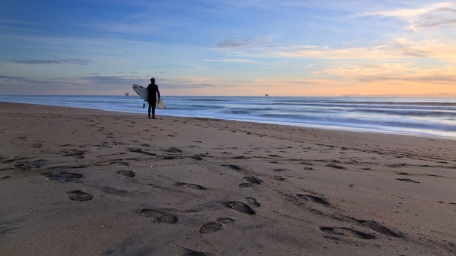 CA. Bolsa Chica State Beach. Surfer and sunset.1.16.2010.jpg